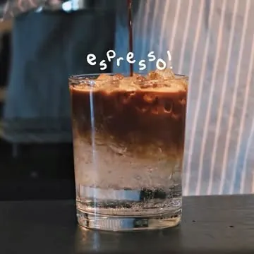 Iced espresso layered over milk, shot from our Instagram